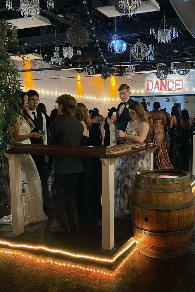 Socializing on the polished dance floor ready for dancing under accent lighting