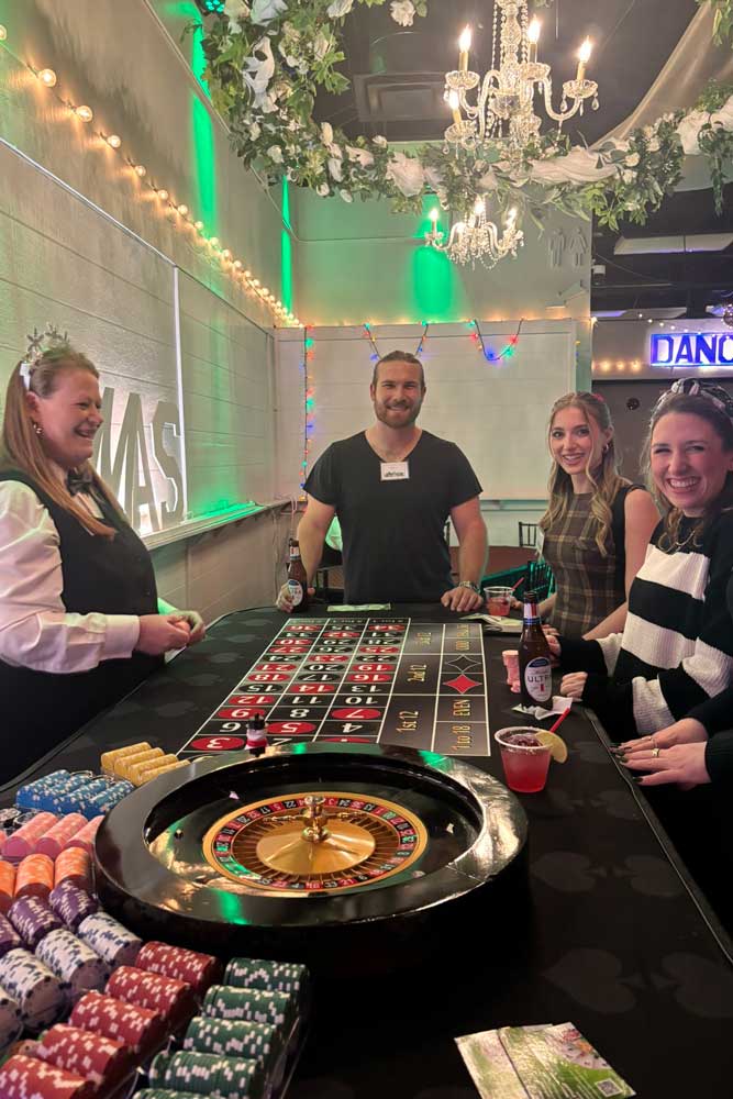 Guests enjoying a Casino Night event in the ballroom.