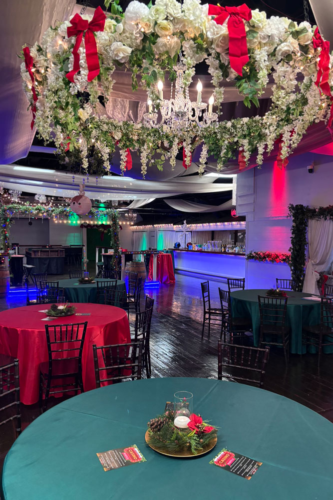 Classic Christmas centerpiece with greenery, candles, and elegant table decor