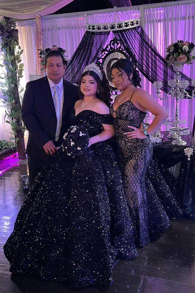 family photo with Mom and Dad with a beautiful purple head table of honor accented in shades of purple.