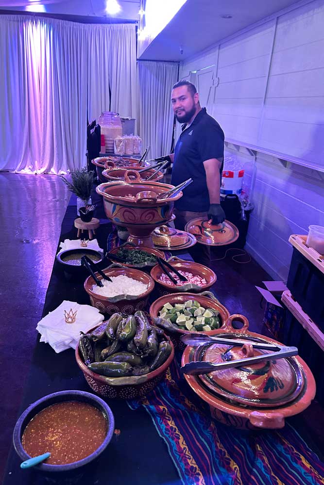 Taco buffet wwith servers that about to serve guests - set up and ready for guests